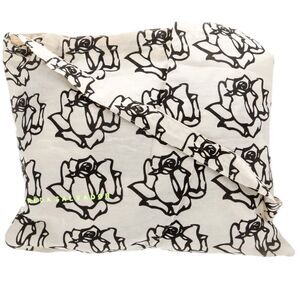 Freda Salvador light canvas crossbody tote with black roses